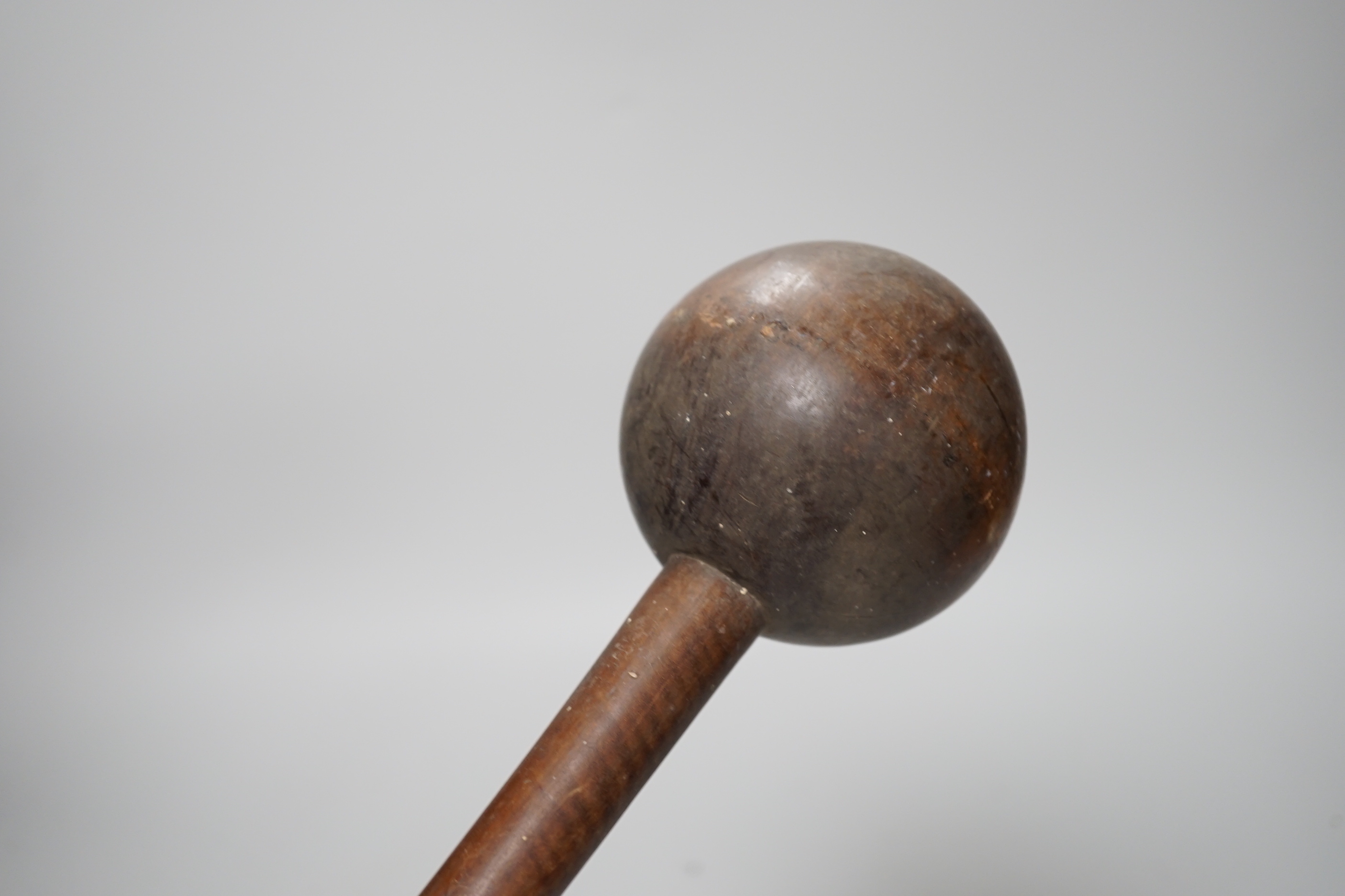 A knobkerrie and another tribal carving, longest 99cm